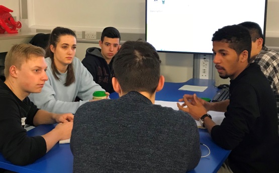 Students working around a table