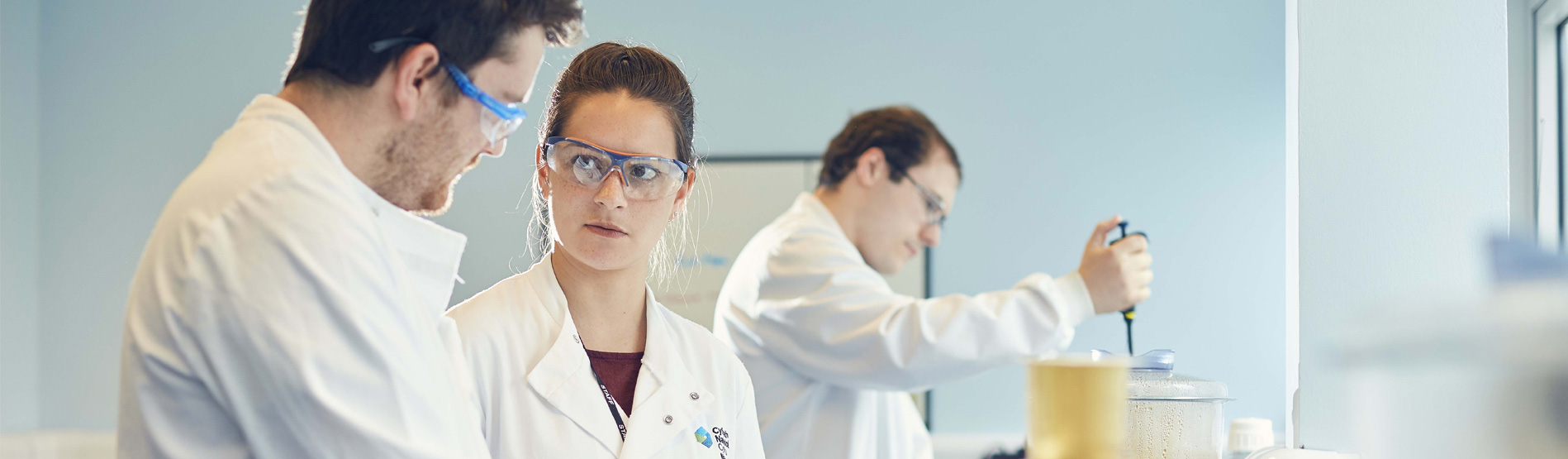 3 students in a lab at Swansea University