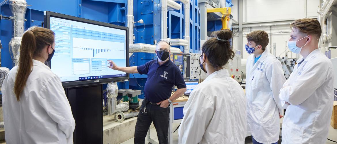 Engineering students working in labs