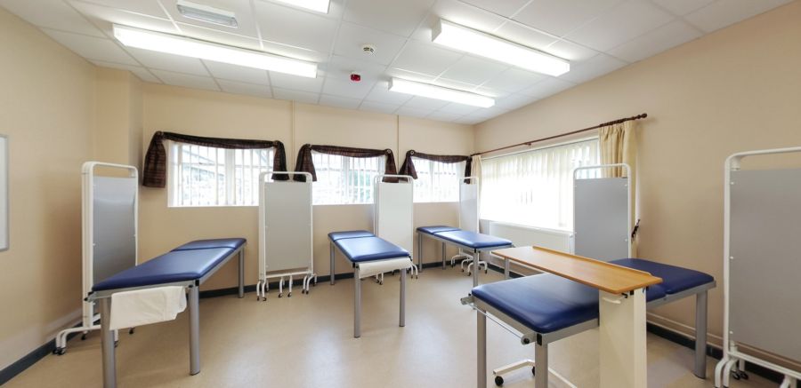 Clinical practice suite with treatment couches and privacy screens
